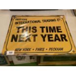 A 'TROTTERS INTERNATIONAL TRADING CO THIS TIME NEXT YEAR...'TIN METAL SIGN