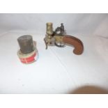 A REPLICA FLINTLOCK TINDERBOX CANDLESTAND AND TWO PERCUSSION CAP BOXES