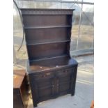 A REPRODUCTION DRESSER COMPLETE WITH PLATE RACK, BEARING ENGLISH ROSE EMBLEM, 36" WIDE