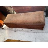 AN UPHOLSTERED OTTOMAN, 54x18"