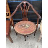 AN EDWARDIAN MAHOGANY ELBOW CHAIR WITH PIERCED SPLAT BACK AND TAPESTRY SEAT