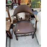 AN EARLY 20TH CENTURY JACOBEAN STYLE ELBOW CHAIR WITH SPLIT CANE BACK A/F