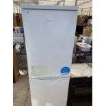 A WHITE CANDY UPRIGHT FRIDGE FREEZER BELIEVED IN WORKING ORDER BUT NO WARRANTY