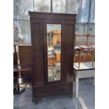 AN EDWARDIAN OAK MIRROR-DOOR WARDROBE, 37" WIDE