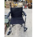 A BLACK CAREMAX WHEELCHAIR