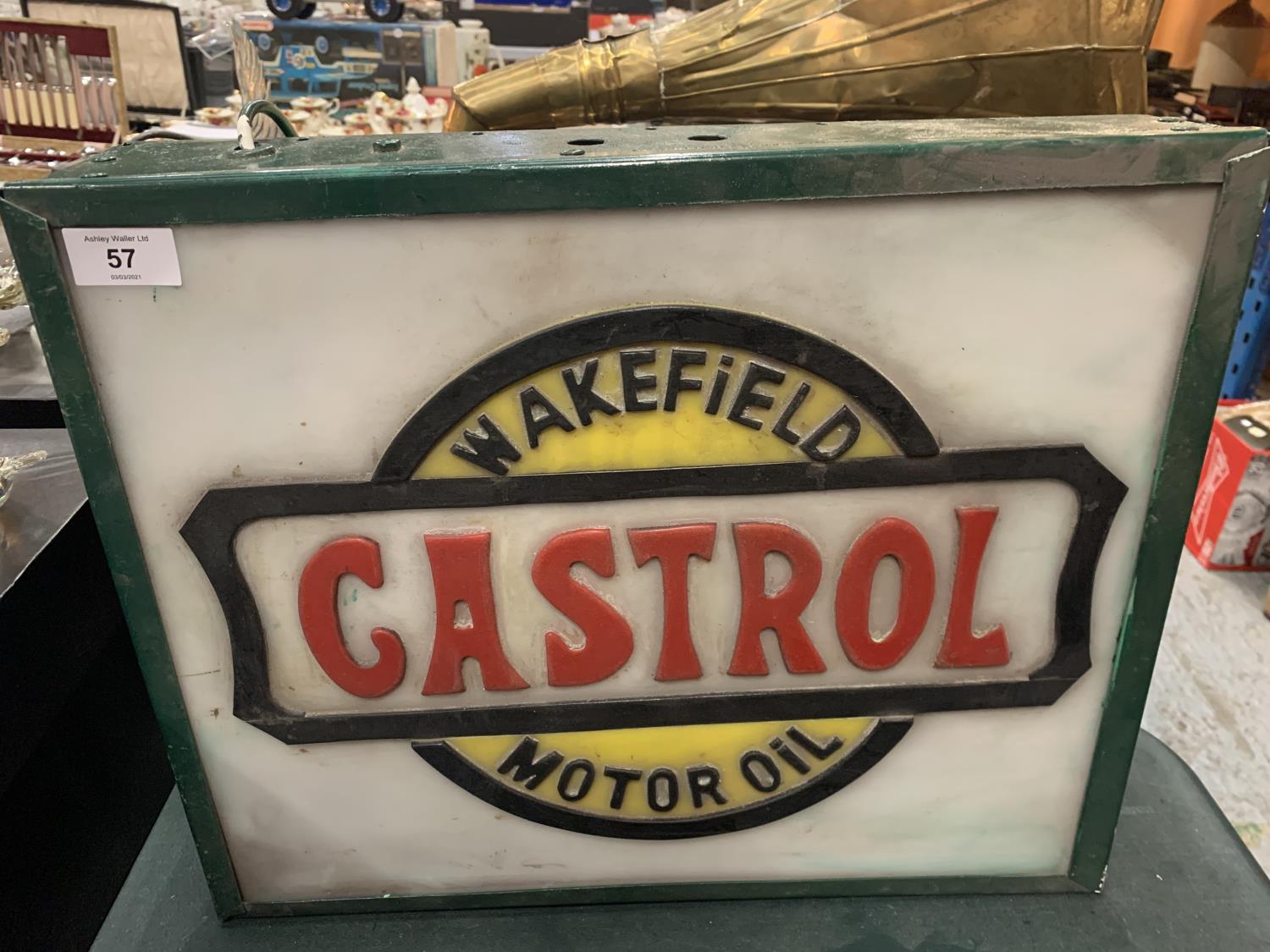 AN ILLUMINATED 'CASTROL' SIGN