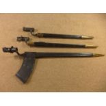 TWO MARTINI HENRY TYPE BAYONETS AND A SOCKET BAYONET (3)