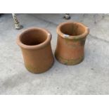 A PAIR OF ROUND CHIMNEY POT TOPS