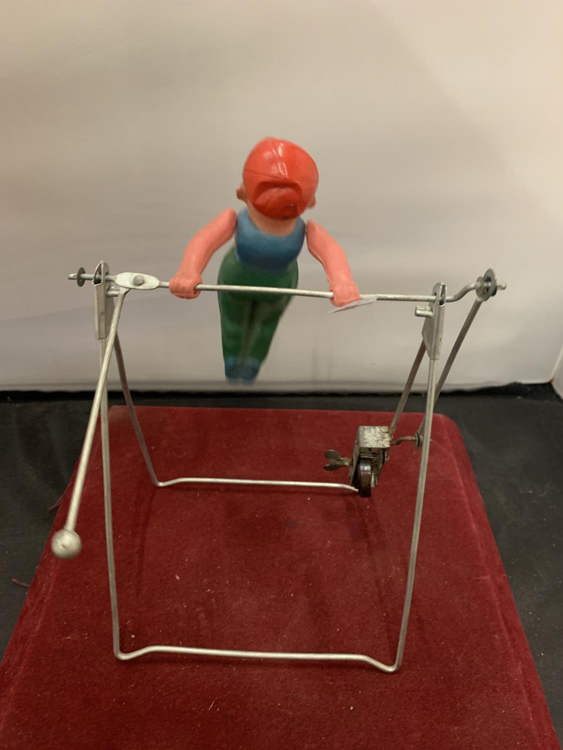 A 1950s GYRATING TOY IN THE FORM OF A GYMNAST - Image 3 of 3