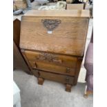 AN EARLY 20TH CENTURY OAK BUREAU, 27" WIDE