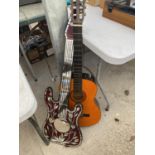 AN ACOUSTIC GUITAR AND A FURTHER DECORATIVE MIRROR GUITAR
