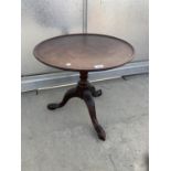 A 19TH CENTURY MAHOGANY TRIPOD TABLE WITH DISHED TOP, 22" DIAMETER