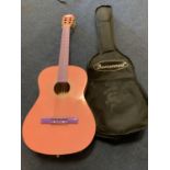 A PINK ACOUSTIC GUITAR WITH CARRYING CASE