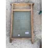 A VINTAGE WOODEN AND GLASS WASH BOARD