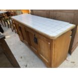 A LARGE PINE FRAMED FOUR DOOR KITCHEN BASE UNIT WITH LATER TILED TOP, 67x21.5x35"