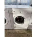 A WHITE CURRYS ESSENTIAL WASHING MACHINE BELIEVED IN WORKING OIRDER BUT NO WARRANTY