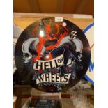 A METAL CIRCULAR 'HELL ON WHEELS' SIGN