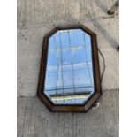 A WOODEN FRAMED BEVEL EDGE MIRROR