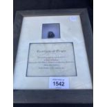 A FRAMED PIECE OF COAL THAT WAS RECOVERED FROM THE WRECK OF THE TITANIC WITH CERTIFICATE OF
