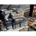 AN EXTREMELY LARGE COLLECTION OF CDS AND DVDS TO INCLUDE MANY UNOPENED BLU-RAY DVDS