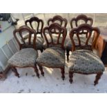 A SET OF SIX VICTORIAN MAHOGANY DINING CHAIRS ONTURNED AND FLUTED FRONT LEGS