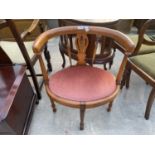 A VICTORIAN STYLE OVAL DRESSING STOOL WITH PIERCED BACK AND TURNED SUPPORTS