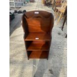 AN EARLY 20TH CENTURY MAHOGANY MAGAZINE RACK WITH THREE SHELVES