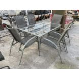 A GARDEN FURNITURE SET WITH A GLASS TOP TABLE AND 6 CHAIRS