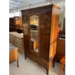 AN EARLY 20TH CENTURY OAK MIRROR-DOOR WARDROBE WITH DRAWER TO BASE, 47" WIDE