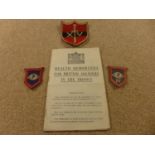 A WORLD WAR II CLOTH BADGE AND A HEALTH MEMORANDA