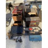 AN ASSORTMENT OF VINTAGE TOOLS TO INCLUDE A BOW SAW, THREE TOOL CHESTS AND A DEED BOX ETC