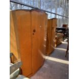 A BIRDS EYE MAPLE THREE PIECE BEDROOM SUITE COMPRISING TWO WARDROBES AND A DRESSING TABLE