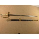 A NAVAL SWORD OF UNKNOWN AGE, THE GRIP DECORATED WITH AN ANCHOR, COMPLETE WITH SCABBARD