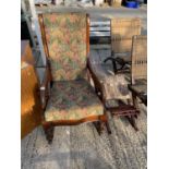 A VICTORIAN STYLE BEECH ROCKING CHAIR AND GOUT STOOL