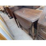 AN EARLY 20TH CENTURY OAK BARLEYTWIST GATELEG TABLE