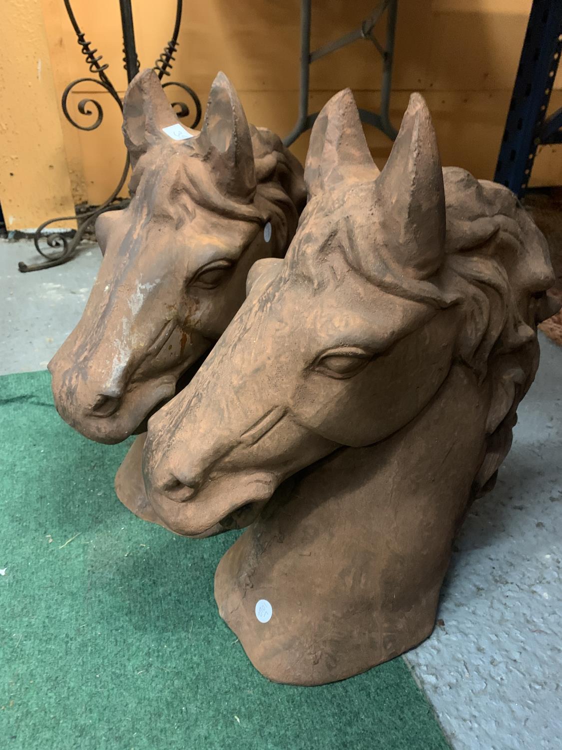 A PAIR OF LARGE CAST (IN THE TERRACOTTA STYLE) HORSES HEADS H:47CM