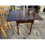 A VICTORIAN MAHOGANY PEMBROKE TABLE ON BRASS CASTERS