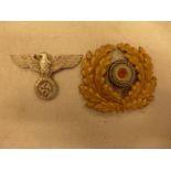 A NAZI GERMANY CAP BADGE AND ANOTHER (2)