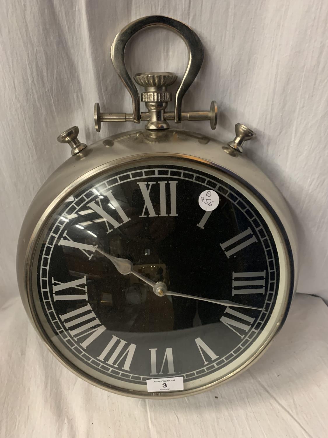 A LARGE WHITE METAL POCKET WATCH WALL CLOCK - 31CM DIAMETER