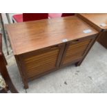 A RETRO TEAK CABINET WITH LOUVRE EFFECT DOORS, 31" WIDE