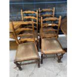 A SET OF FOUR LADDER-BACK DINING CHAIRS ON TURNED FRONT LEGS