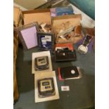 AN ASSORTMENT OF ITEMS TO INCLUDE TRAVEL ALARM CLOCKS, WIND CHIMES, PHOTO FRAMES ETC