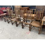 A SET OF SIX JACOBEAN STYLE OAK DINING CHAIRS WITH SPLIT CAN BACKS (LACKING FOUR DROP-IN SEATS)