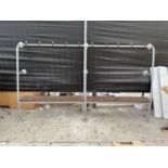 A TUBULAR STEEL FRAMED LOCKER ROOM LONG SEAT WITH TEN COAT HOOKS, 107" WIDE