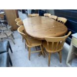 A MODERN PINE TWIN PEDESTAL EXTENDING DINING TABLE, 60x42" (LEAF 15") AND EIGHT CHAIRS