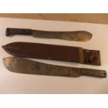 A WORLD WAR II MACHETE AND LEATHER SCABBARD AND A MARTINDALE MACHETE (2)