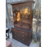 A VICTORIAN MAHOGANY TWO DOOR BOOKCASE ON CHEST BASE OF TWO SHAM AND TWO LONG DRAWER, 46" WIDE