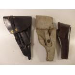 THREE LEATHER HOLSTERS