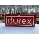 AN ILLUMINATED 'DUREX' SIGN