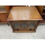 AN ANTIQUE STYLE OAK GLAZED TV STAND